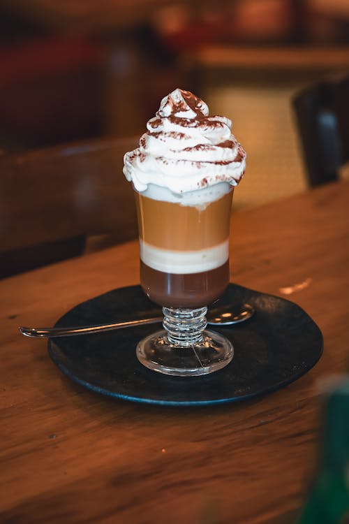 A coffee drink with whipped cream on top