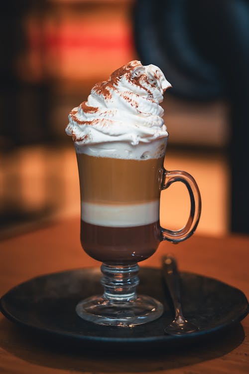 A coffee drink with whipped cream on top