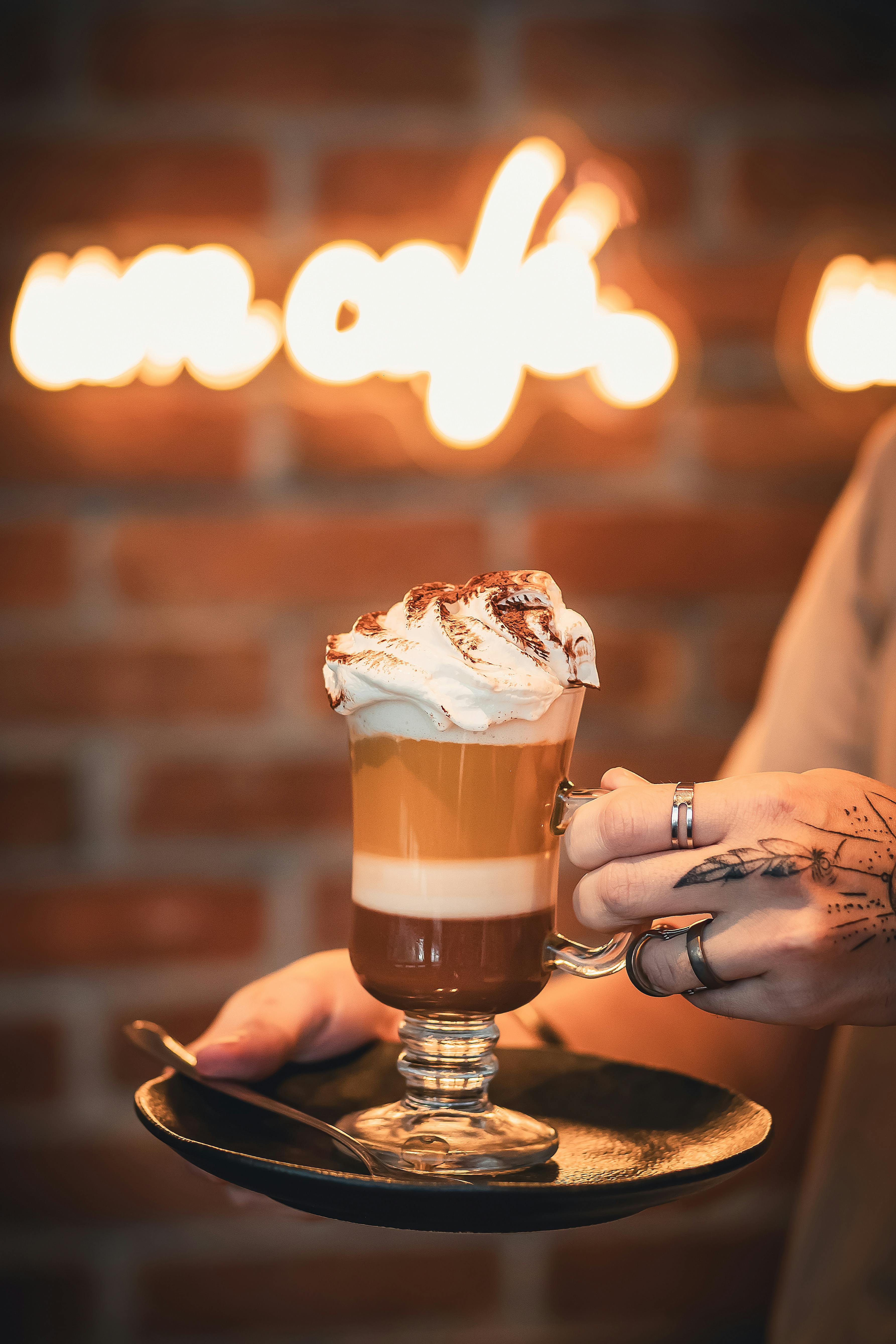 Indulge in a creamy cappuccino with whipped cream in a trendy Rio de Janeiro café.