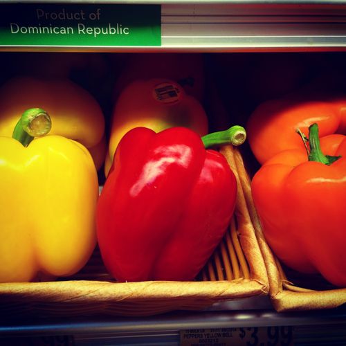 Free Vibrant bell peppers from the Dominican Republic on display at a market. Stock Photo