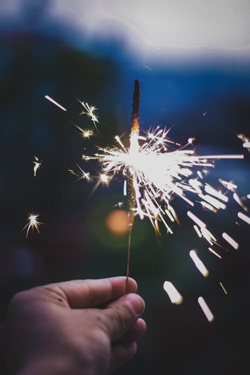 Free Person Holds Lighted Sparkler Stock Photo