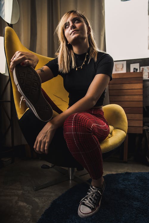 Woman Sits on Accent Chair