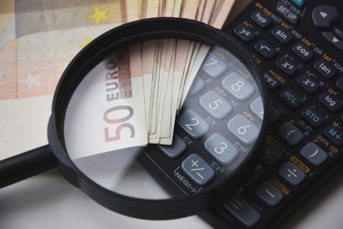 Free 50 Euro Banknote Beside Black Calculator Stock Photo