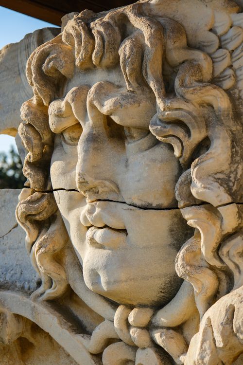 Free Capture of a detailed Medusa sculpture at the Temple of Apollo, Aydın, Türkiye. Stock Photo