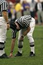 Person in Black and White Striped Uniform