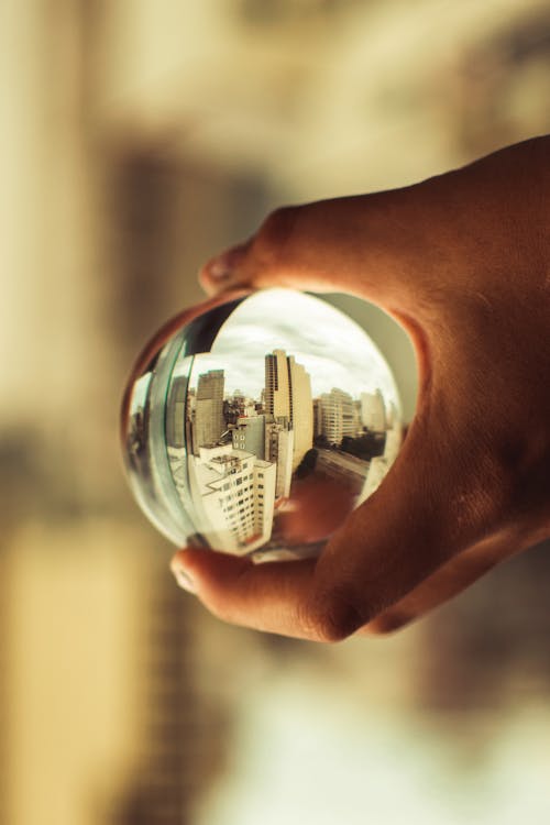 Free Close-Up Photo of Person Holding Lensball Stock Photo