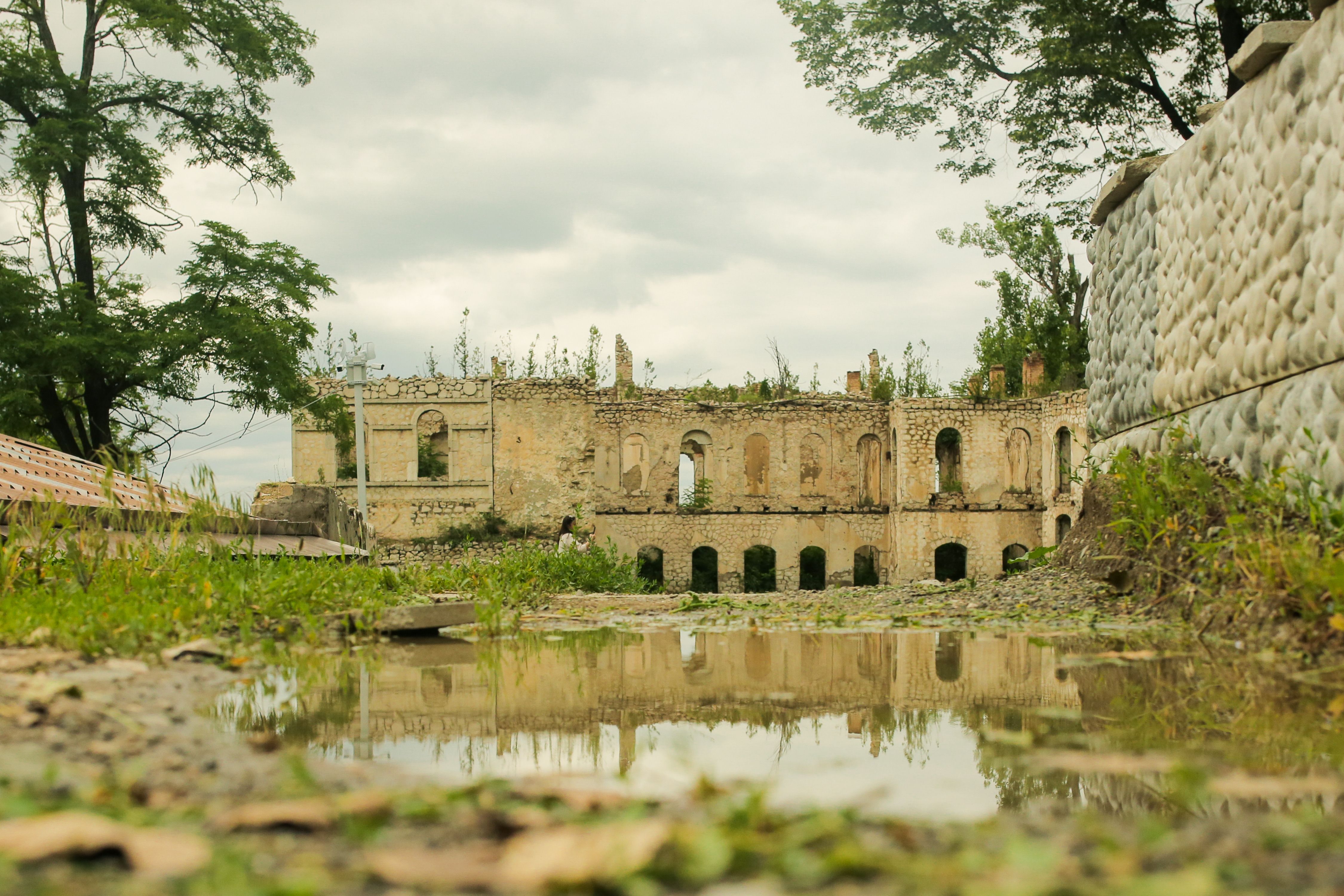Puddle in Front of an Old Ruin · Free Stock Photo