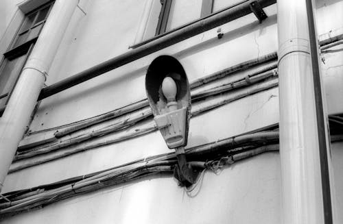 A black and white photo of a street light