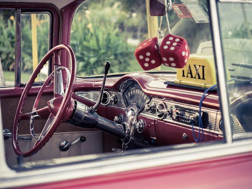 Selective Focus Photography of Red Vehicle Interior