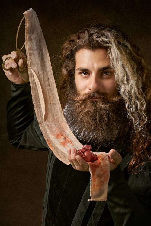 Man Holding Piece Of Cloth