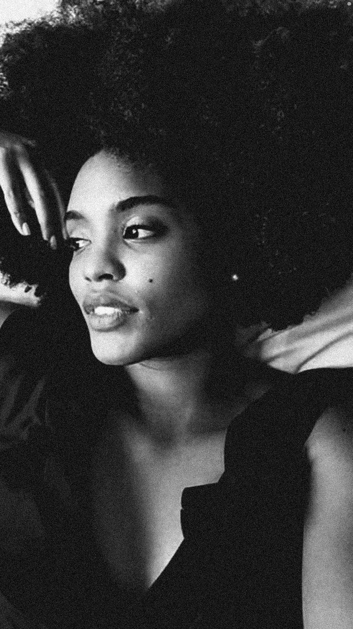 Woman with natural hair in shadow