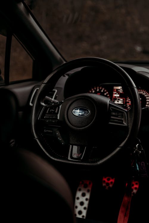 A close up of the steering wheel and dashboard of a car