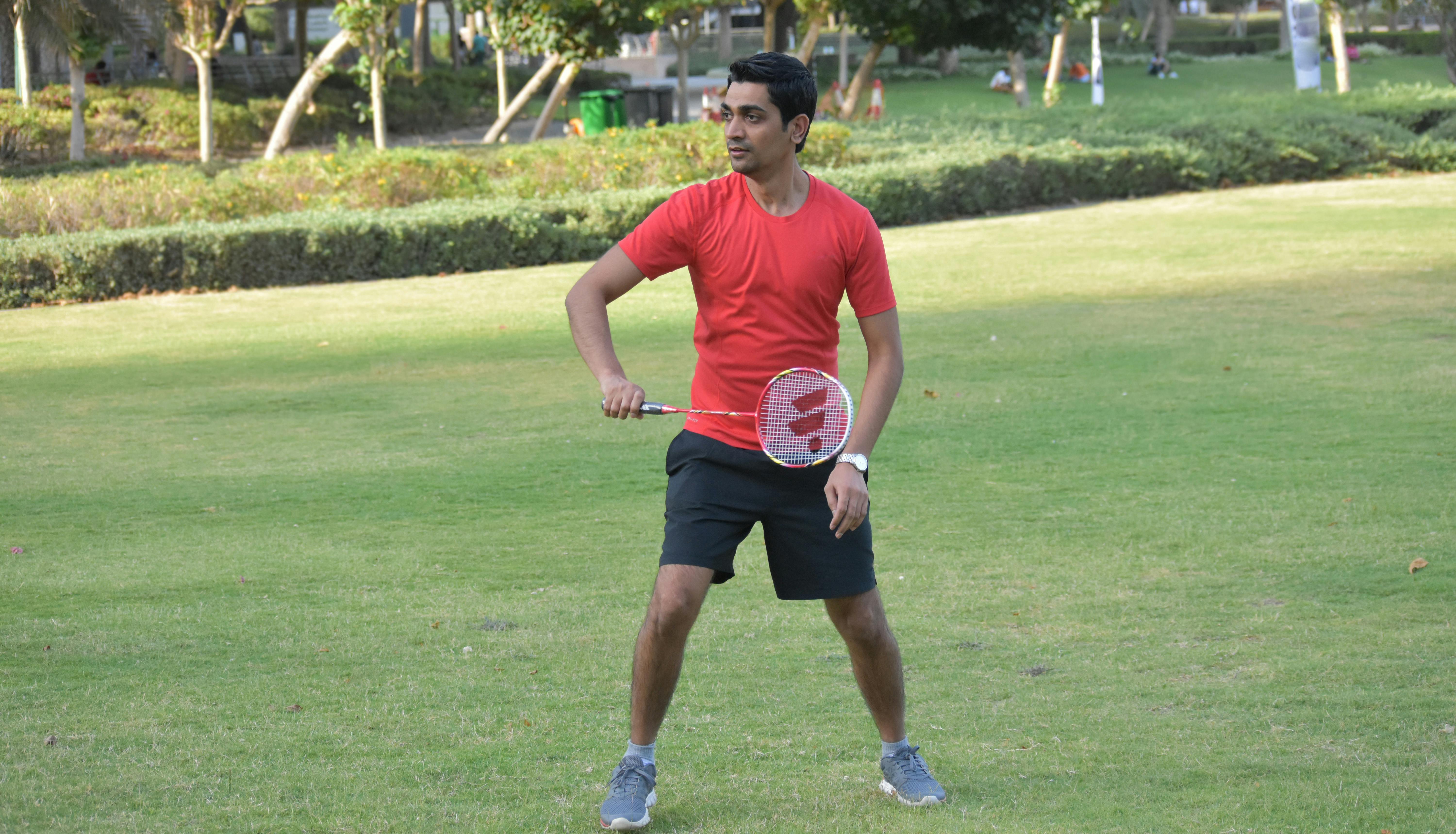 Free stock photo of boy playing badminton in park HD, boy playing in park, foot ball