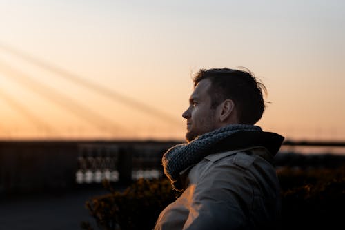 Free Man Wearing Gray Coat during Golden Hour Stock Photo