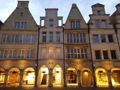 Brown Concrete Buildings With Lights on