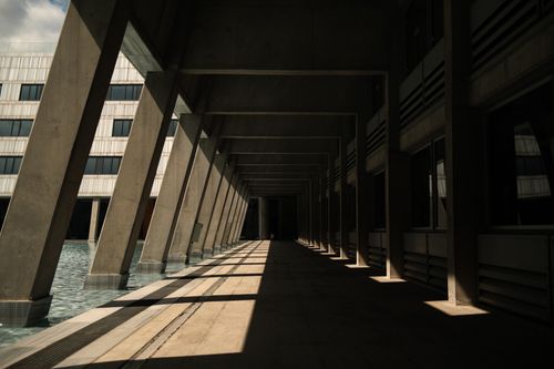 Free Empty modern architectural corridor in Ankara, Türkiye with striking shadows. Stock Photo