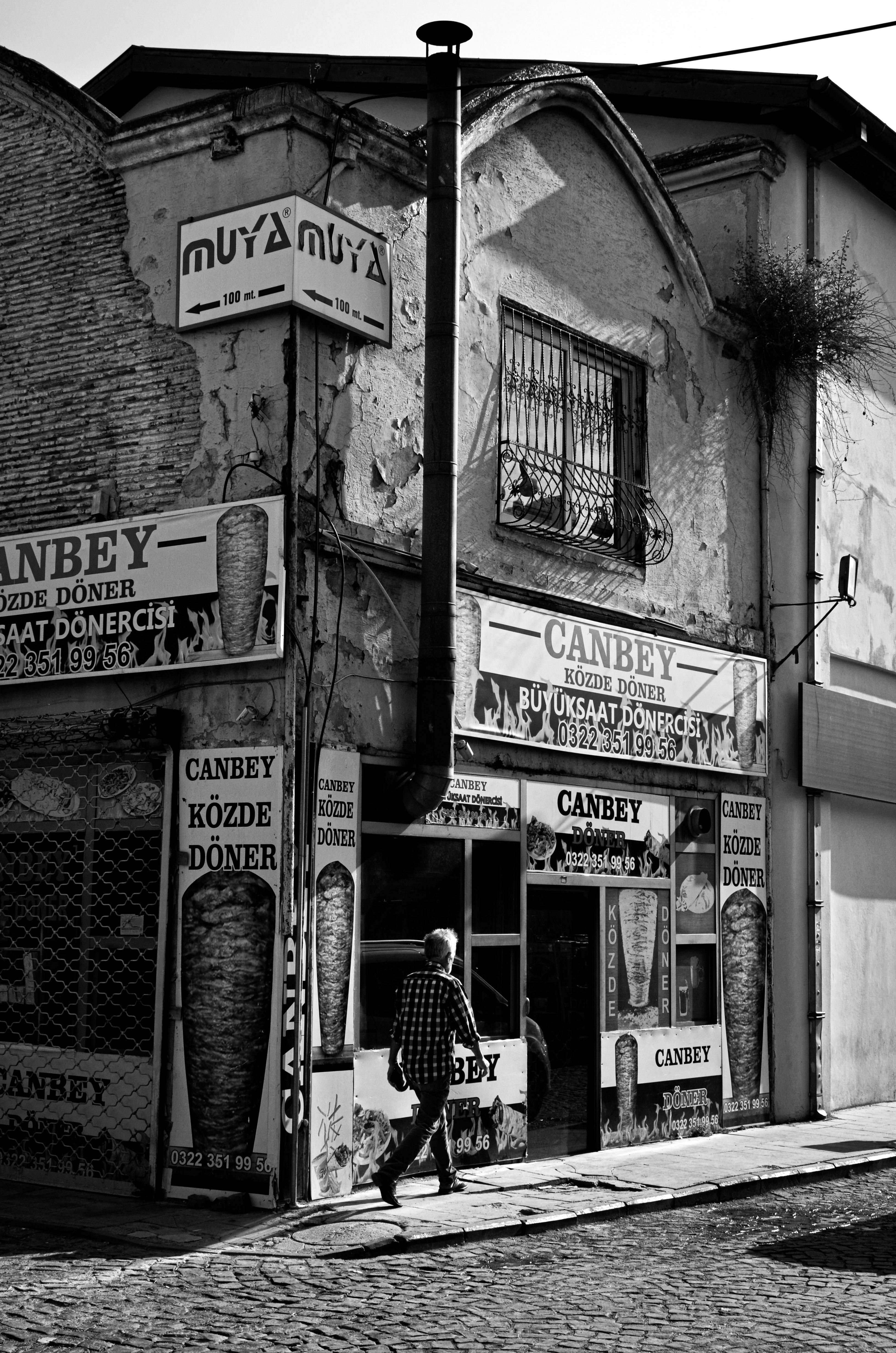 Man on an Old Street in Black and White · Free Stock Photo