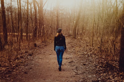 Free Woman Walking in the Forest Stock Photo