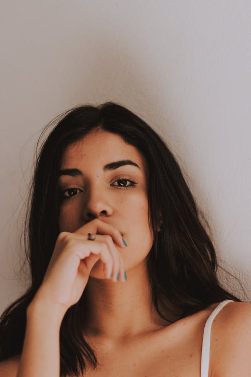 Woman Covering Mouth With Her Hand