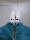 Person Wearing White Low Top Sneakers