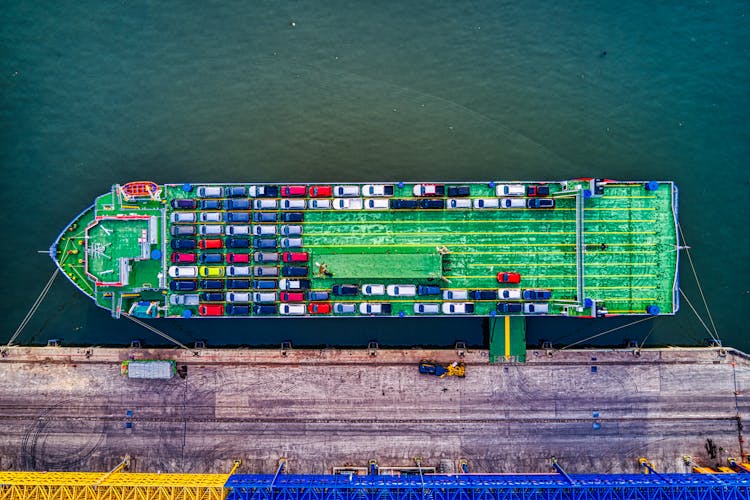 Green Cargo Boat Beside Dock