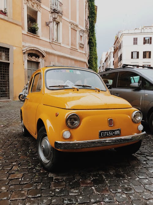 Yellow Vehicle Parked Near Building