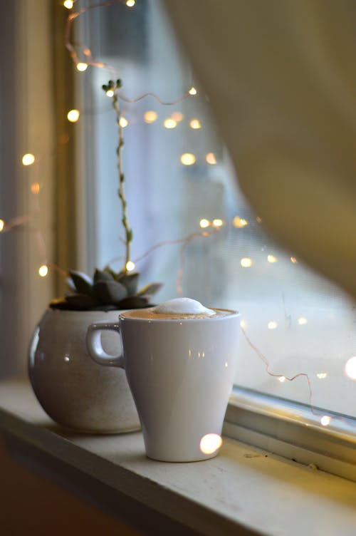 Free Cup of Cappuccino Near Window Stock Photo
