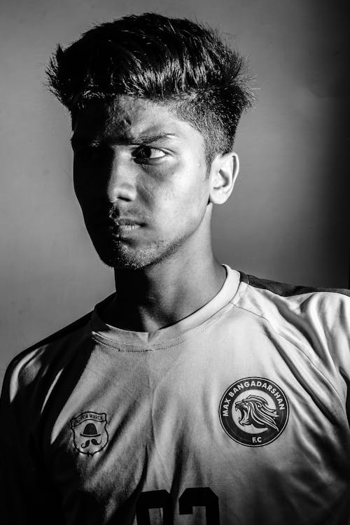 Grayscale Photo of a Man Wearing Jersey Shirt