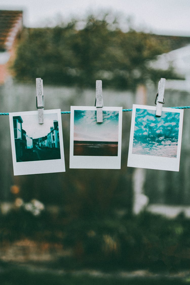 Three Photos Hanged Using Clothes Pin