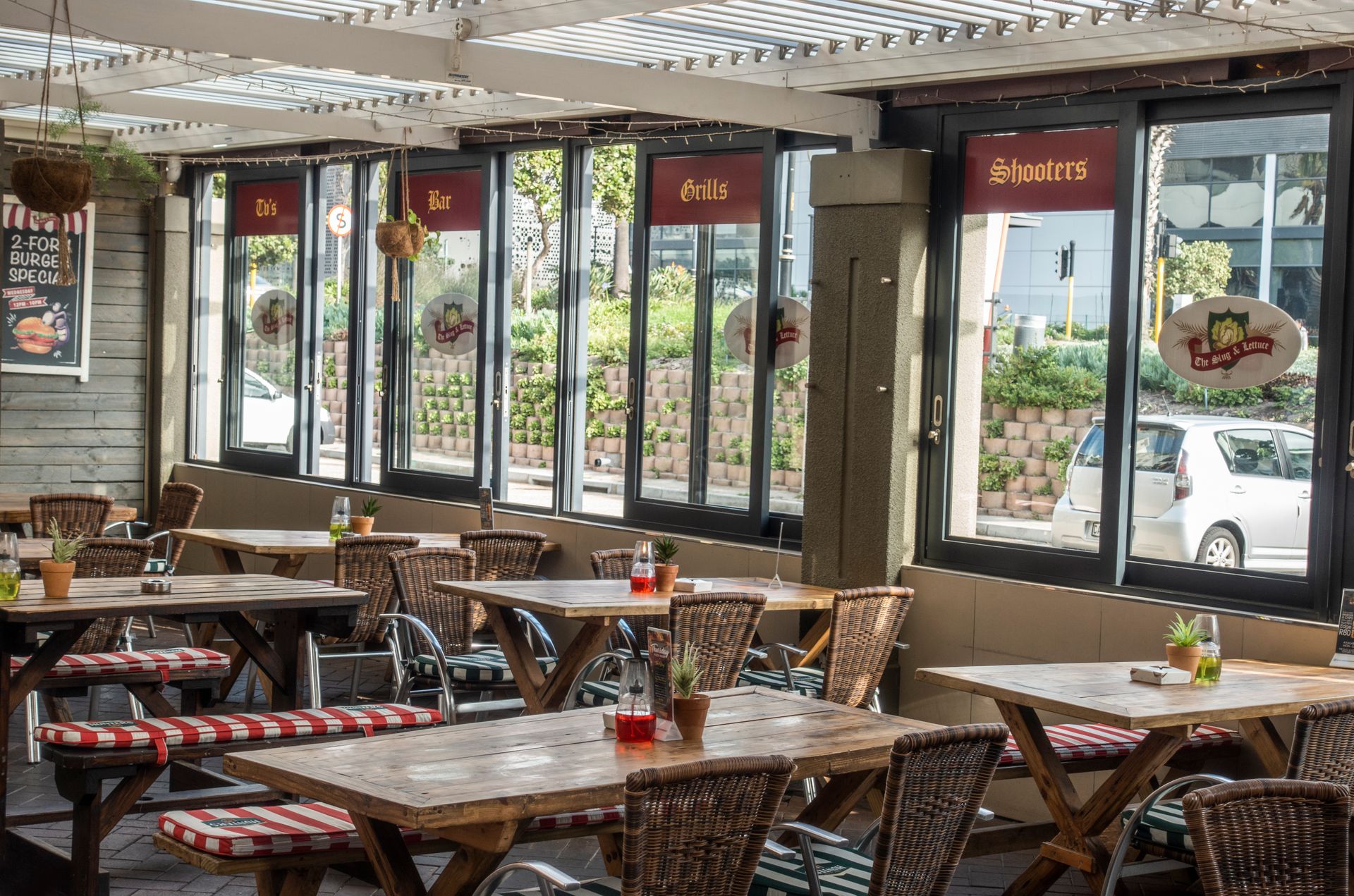 Inviting indoor restaurant with rustic wooden tables and natural light creates a cozy dining atmosphere.