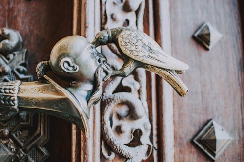 Bird Pricking Man's Head Brass Ornament