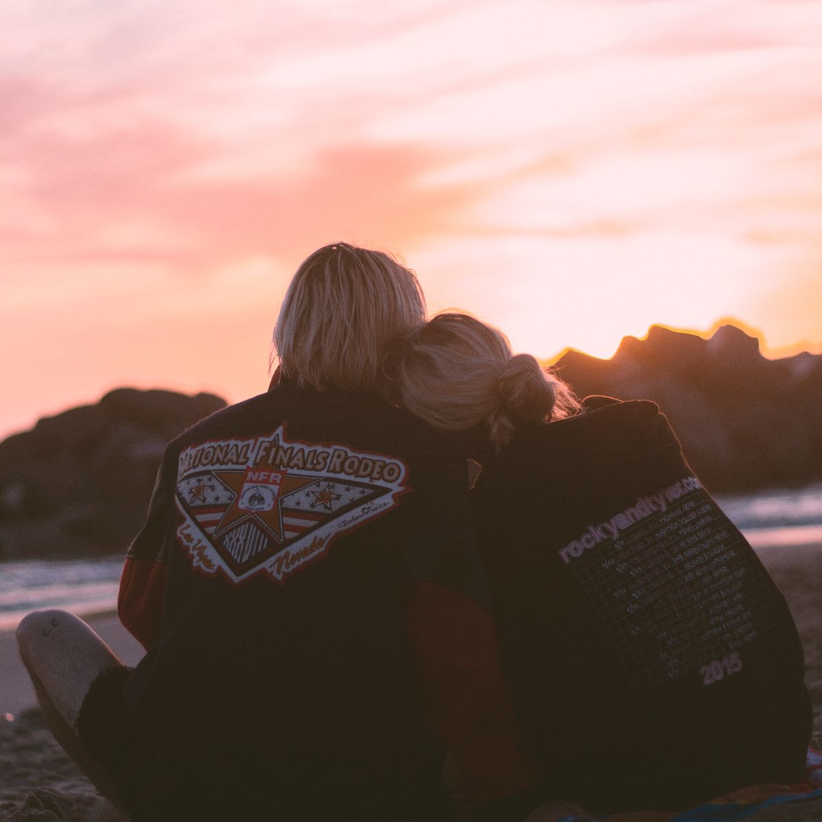Couple cuddling together peacefully in nature