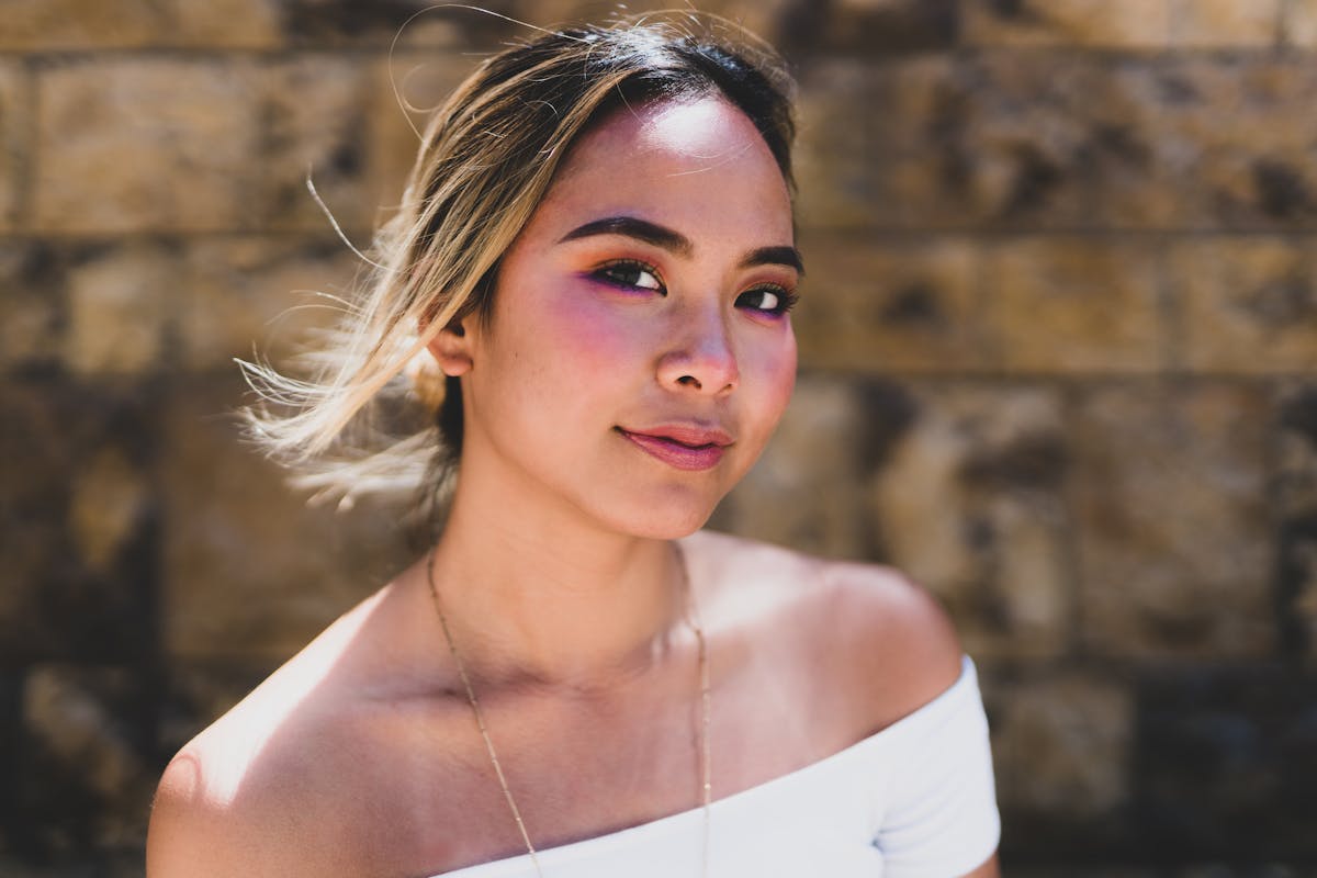 Neon bar sign in a dimly lit street, evoking nightlife and bar culture