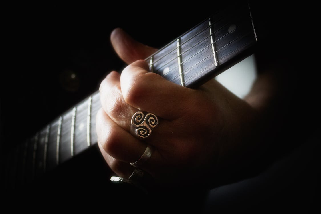 Free stock photo of guitar chord, guitarist, hand on guitar