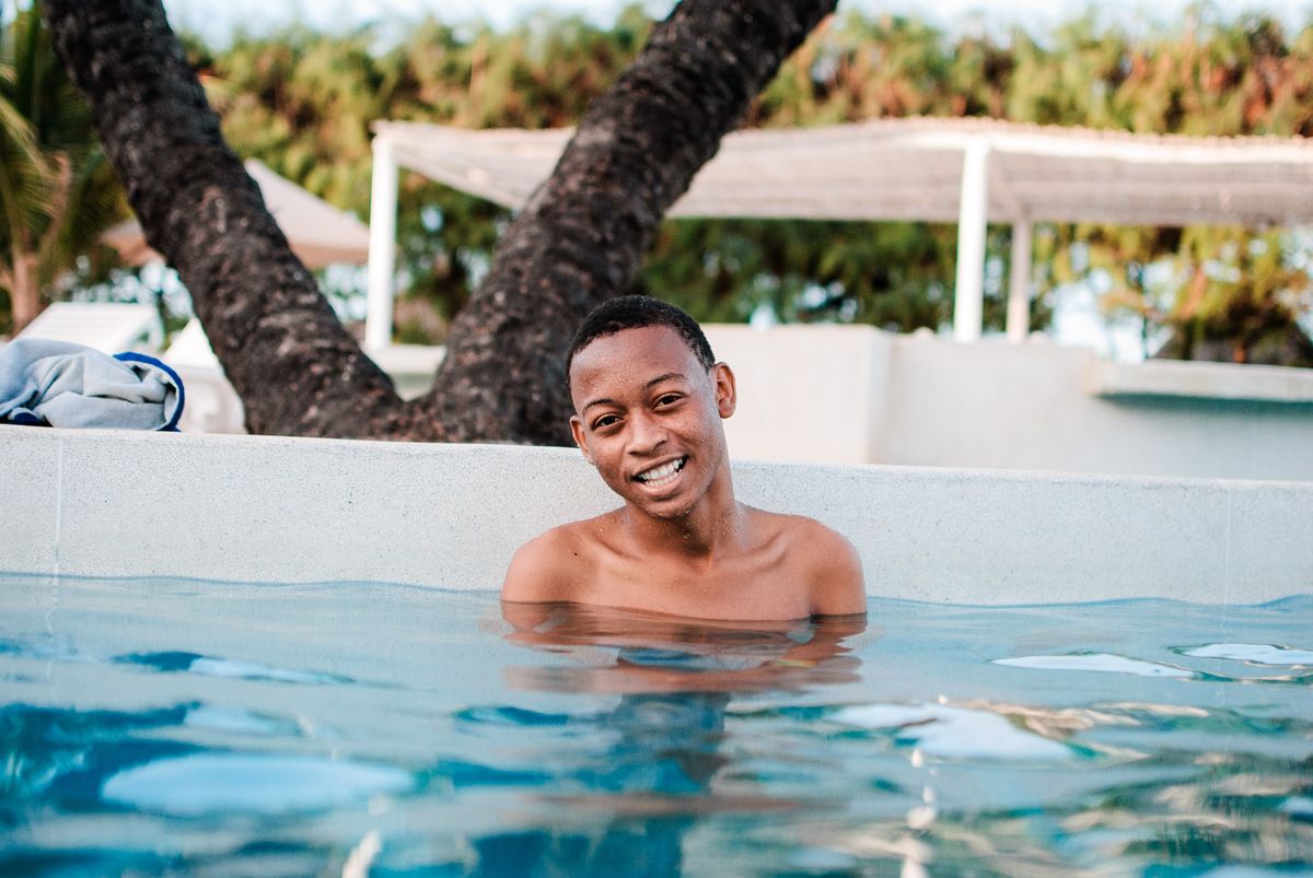 Man swimming in an outdoor pool