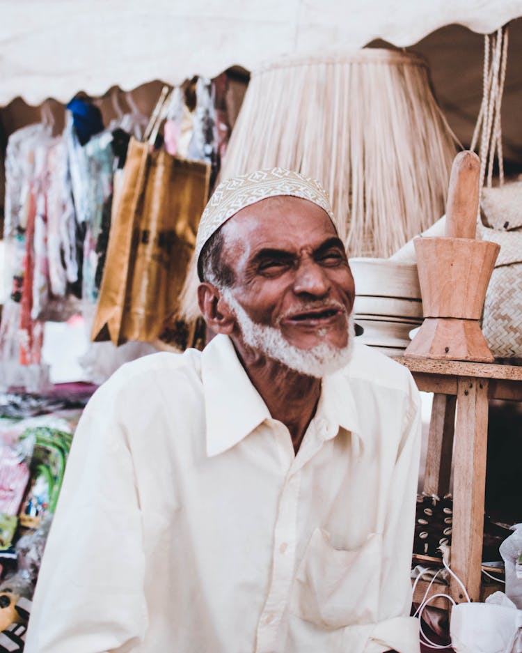 Man Wearing Taqiyah Cap At The Market