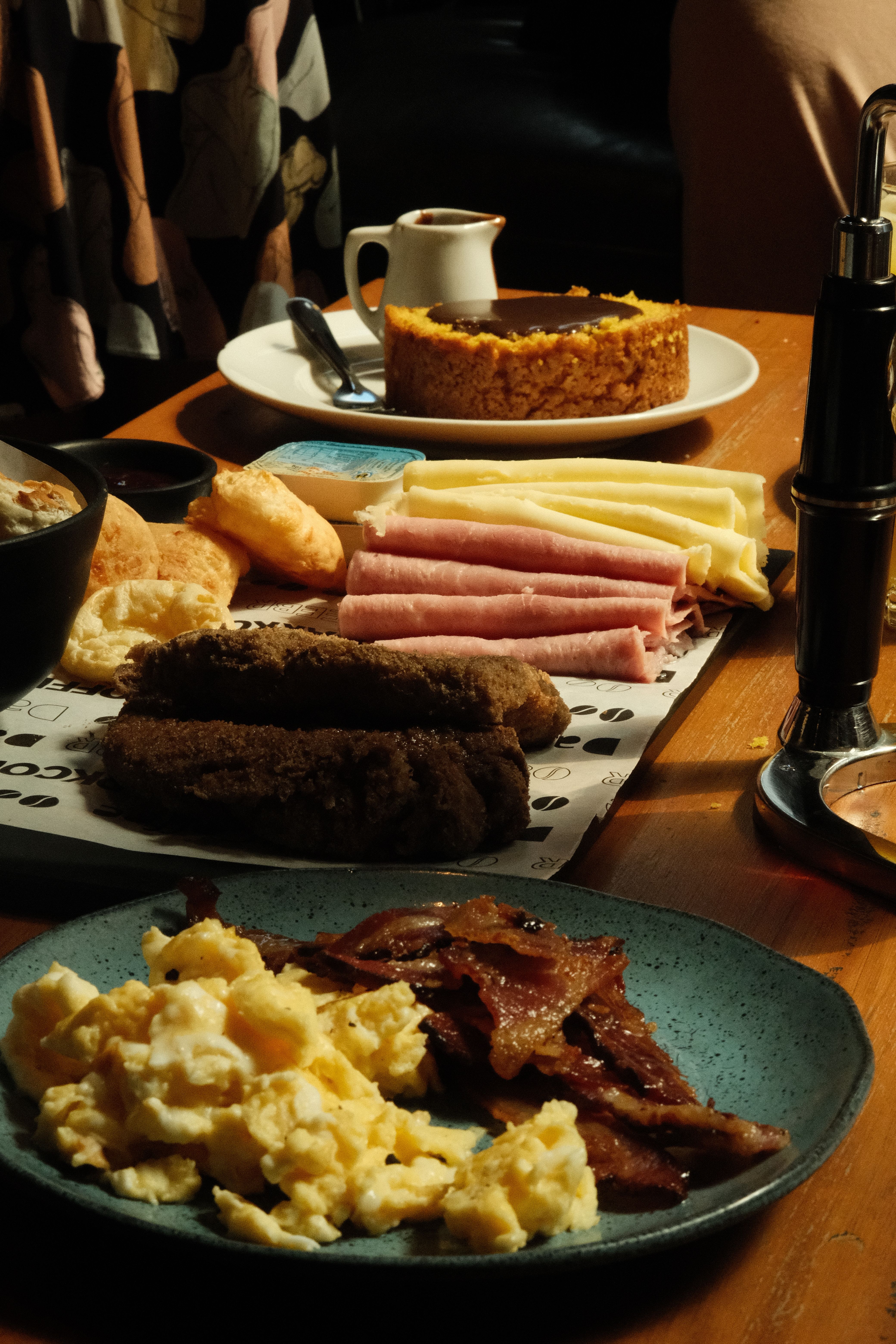 Savory breakfast spread with ham, eggs, and cheese.