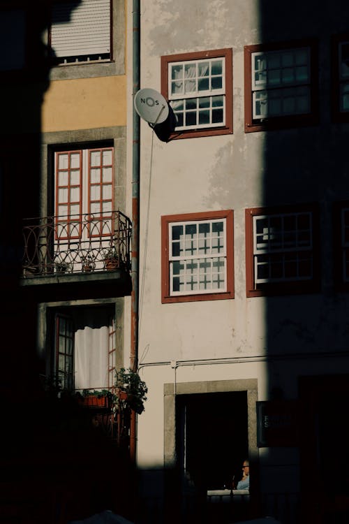 A building with a balcony and a window