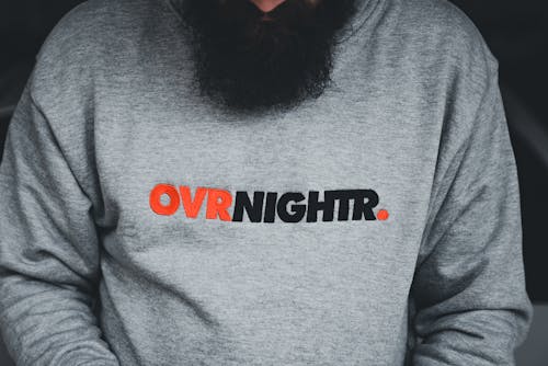 A man with a beard wearing an over night hoodie