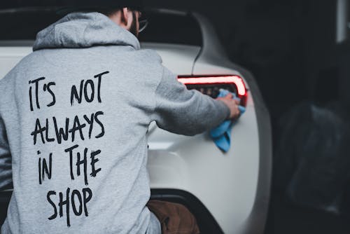 A man in a hoodie that says it's not always in the shop