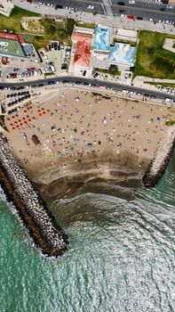 Stunning aerial view of Mar del Plata beach crowded with tourists enjoying the summer day.
