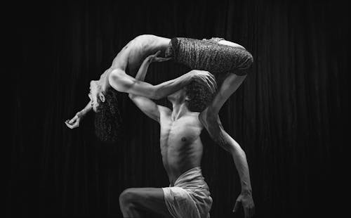 A black and white photo of two dancers