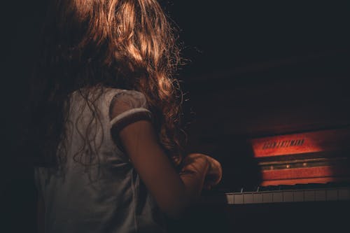 Free Photo of Girl Playing Piano Stock Photo
