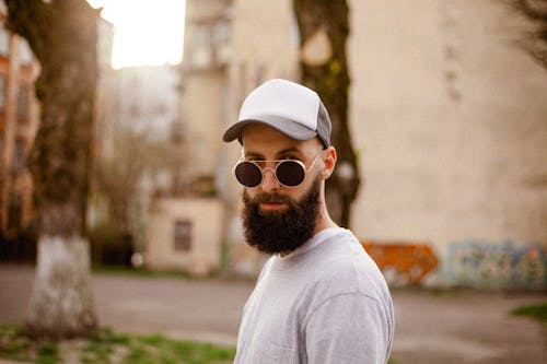 Man Wearing White Baseball Hat