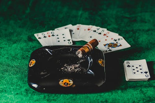 Brown Tobacco on Black Ashtray