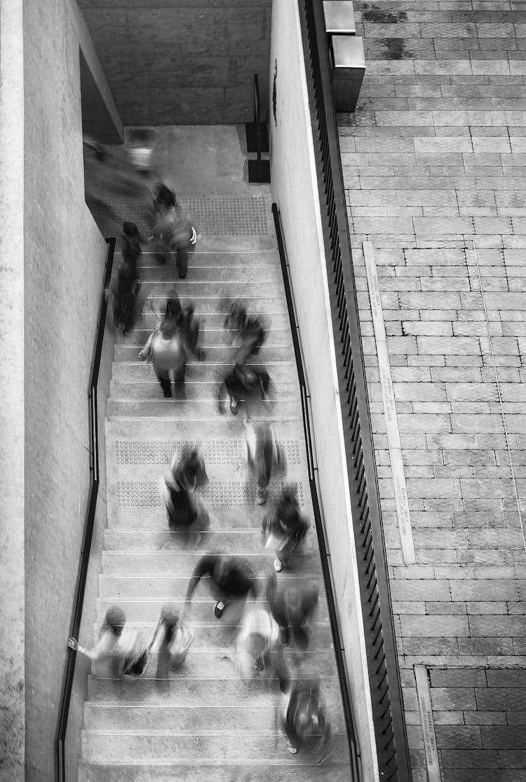 People In Motion Going Through A Doorway