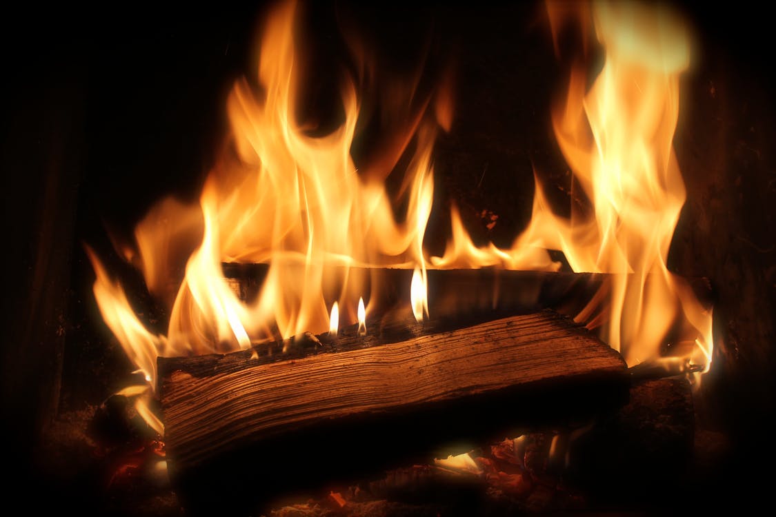 firewood burning in a fireplace