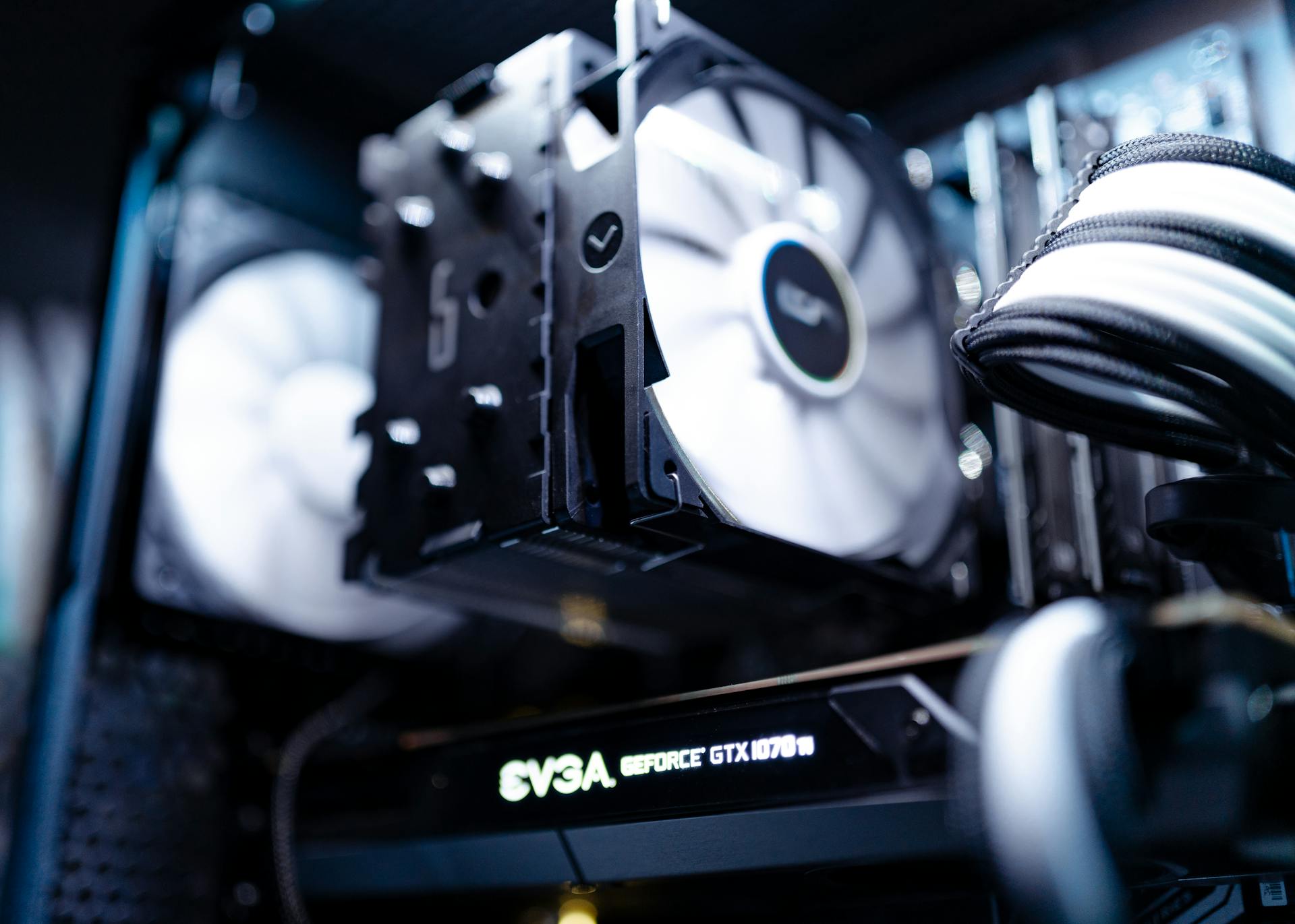 Detailed view of a cooling fan inside a modern gaming PC setup.