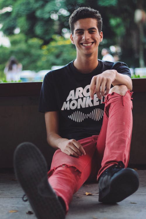 Smiling Man Sitting on Floor