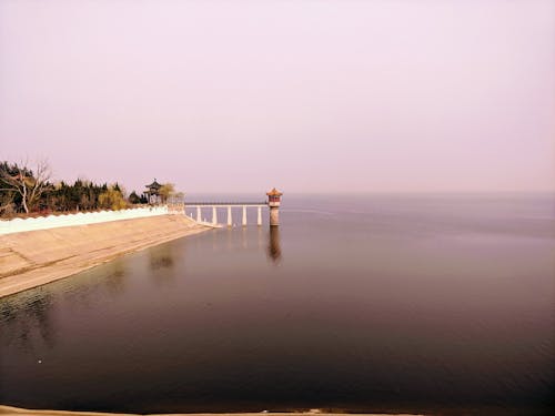 lighthouse at body of water